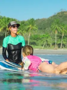 surf instructor with girl