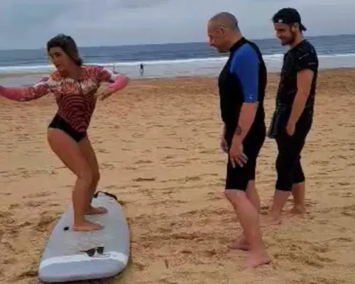 woman surf instructor with students