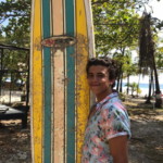 Two partners, one mission, have fun surfing! A jordan young men with a surfboard